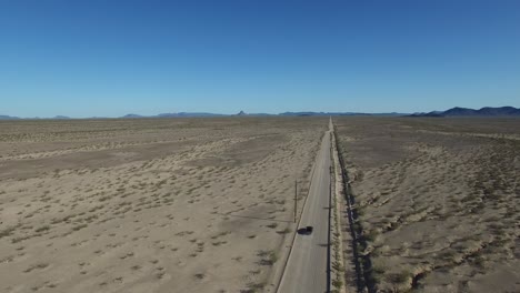 car on desert highway aerial