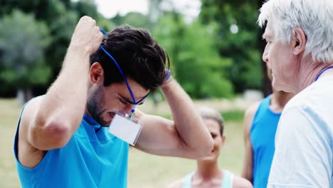 volunteer registering athletes name for race