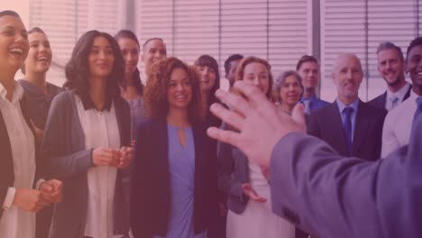 Animation-of-smiling-group-of-diverse-business-people-clapping-at-meeting