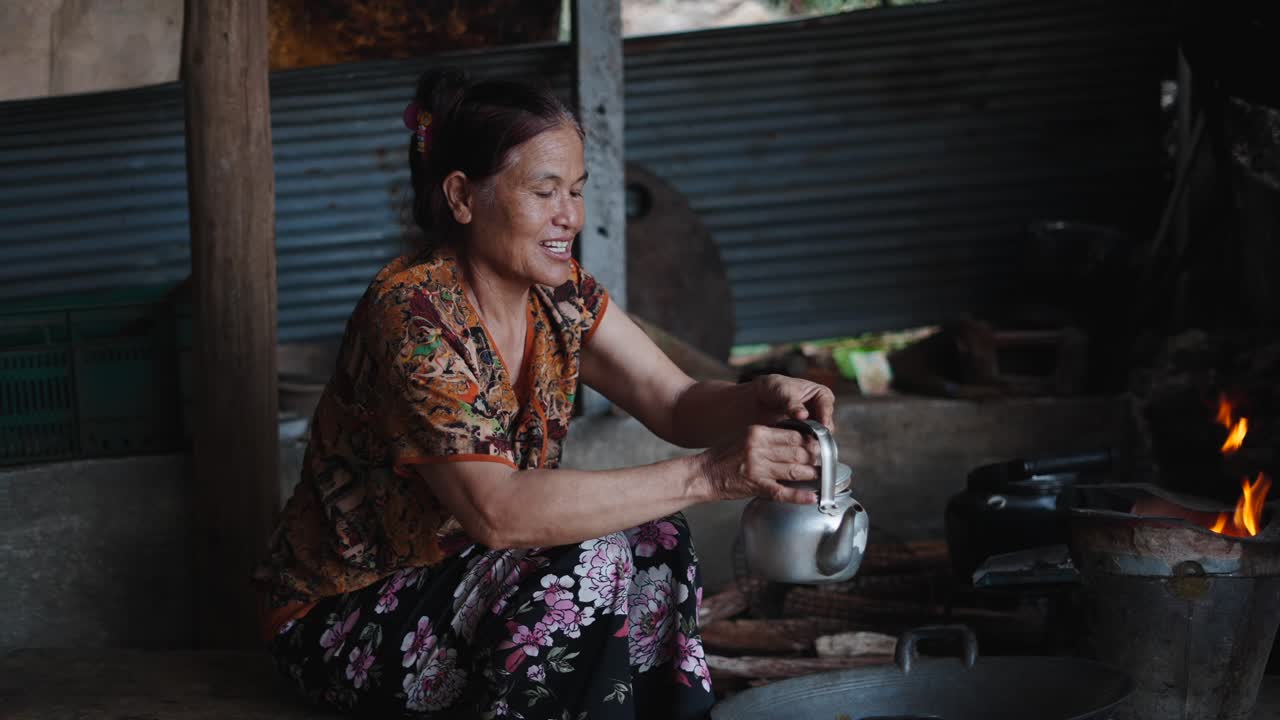 Woman cooking on a traditional stove