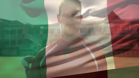 animation of flag of italy over caucasian rugby player with ball