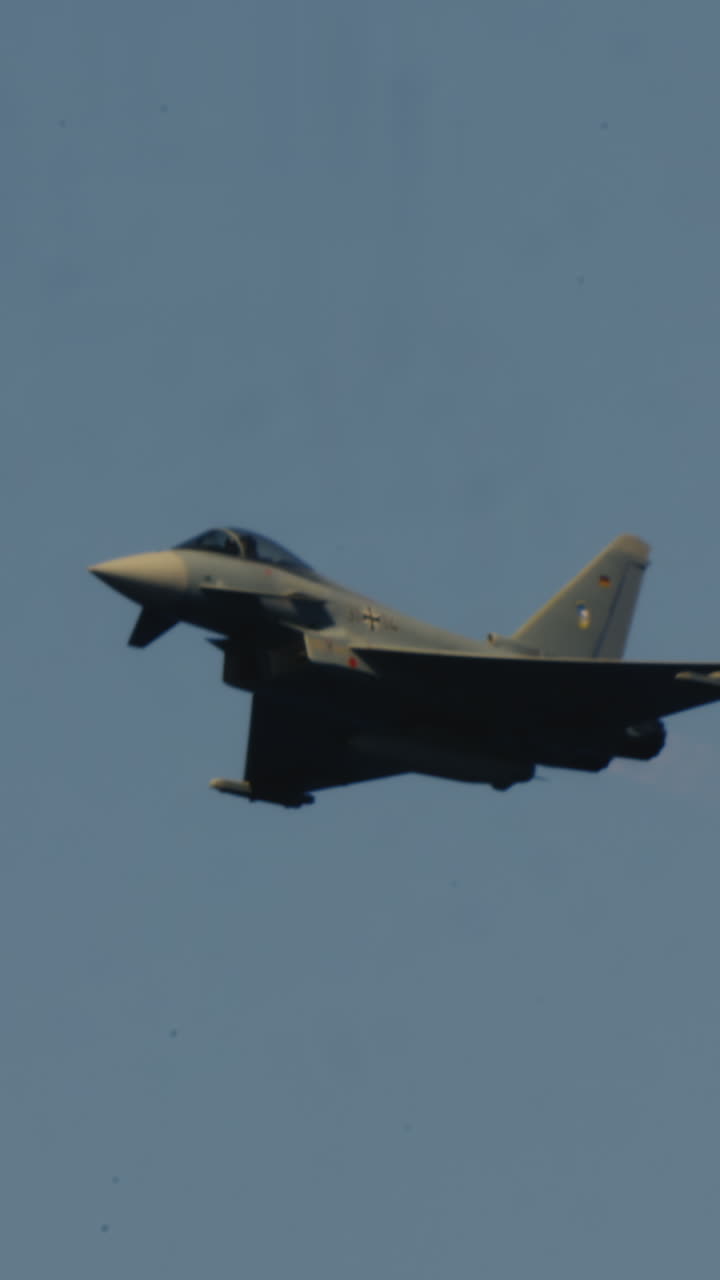 Eurofighter Typhoon Fighter Jet Flying Across Clear Blue Sky