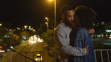 couple kissing each other in city 4k