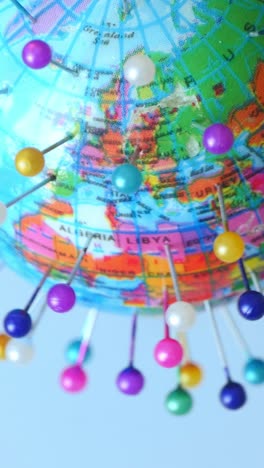 spinning globe earth with pins