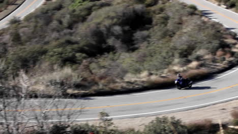 motorcycle and cars on winding mountain road 1