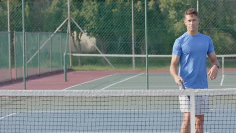 caucasian male tennis player talking across the net to opponent at outdoor court in slow motion