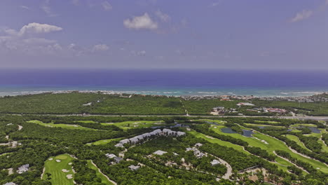 akumal mexico aerial v12 flyover riviera maya golf course capturing gran bahia principe resorts surrounded by natural landscape and vast expanse of ocean views - shot with mavic 3 pro cine - july 2023