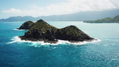 smooth aerial shot of the beautiful mokulua islands located off the lanikai coast of oahu