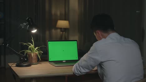 person working late at night on laptop