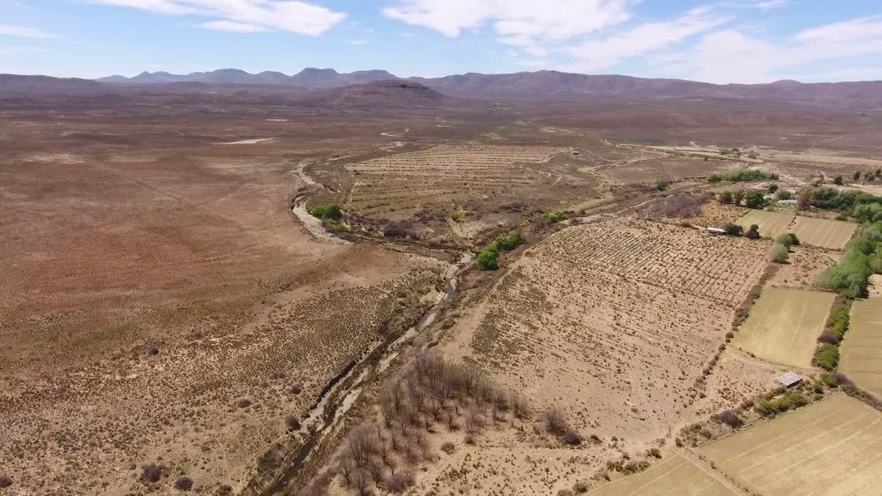 Aerial view of rural farmland in the arid Karoo region of South Africa with irrigated pastures