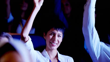 young asian businesswoman raising hand in business seminar at auditorium 4k