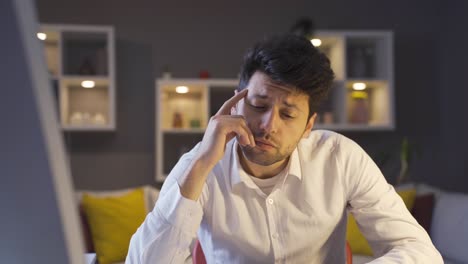 Thoughtful-businessman-working-in-his-home-office.