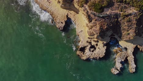 Drone-shot-of-the-cliffs-by-the-coast-in-Lagos