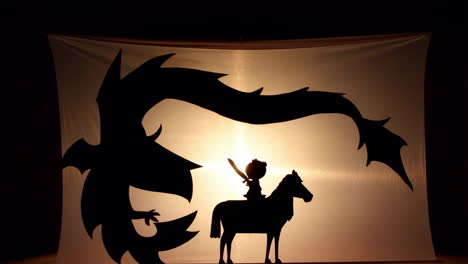 shadow puppet show: knight and dragon