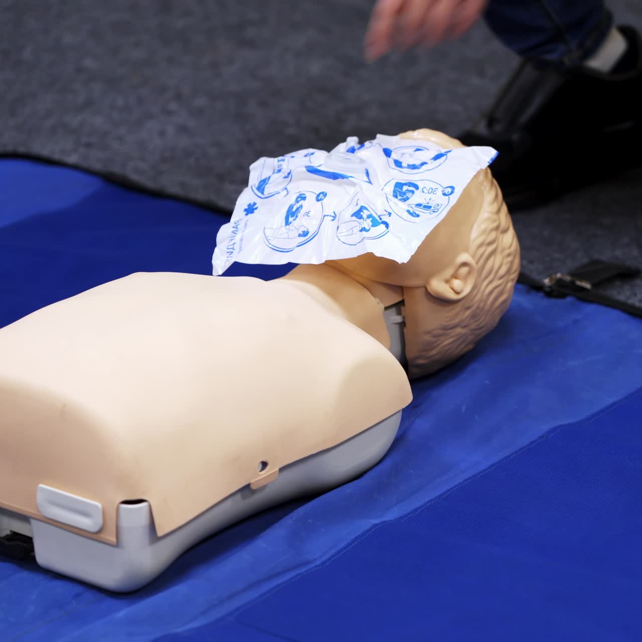 First medical help training equipment. Medical dummy and oxigen mask. Training video