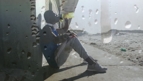 animation of drops of water over exercising african american man taking a break drinking water