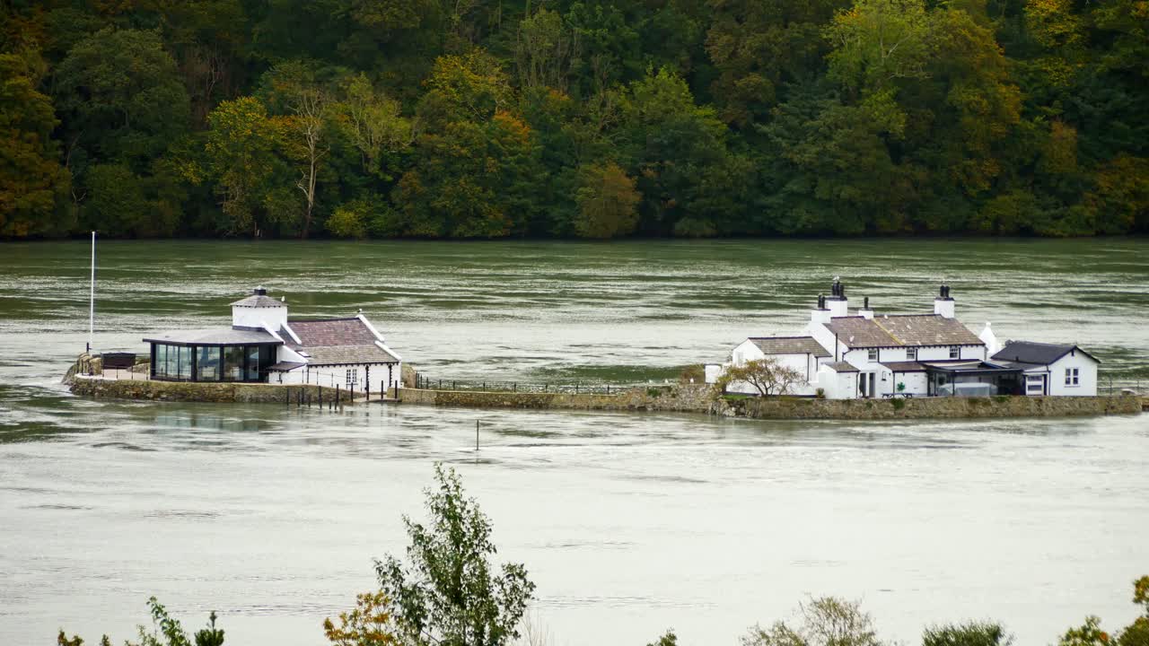 Menai Straits Swellies flowing around isolated Whitebait river cottage Welsh island property