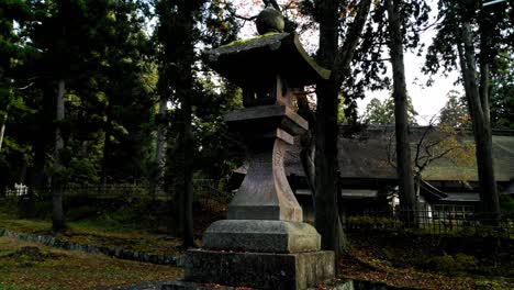 a stone lantern at a japanese shrine