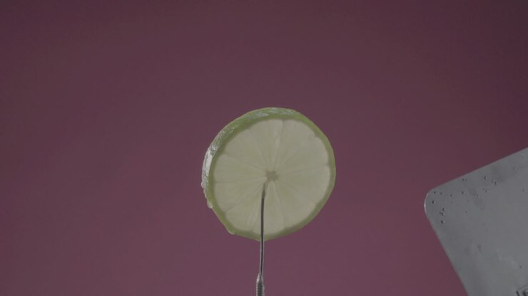Lemon rotating with loop on fuchsia screen for chroma key