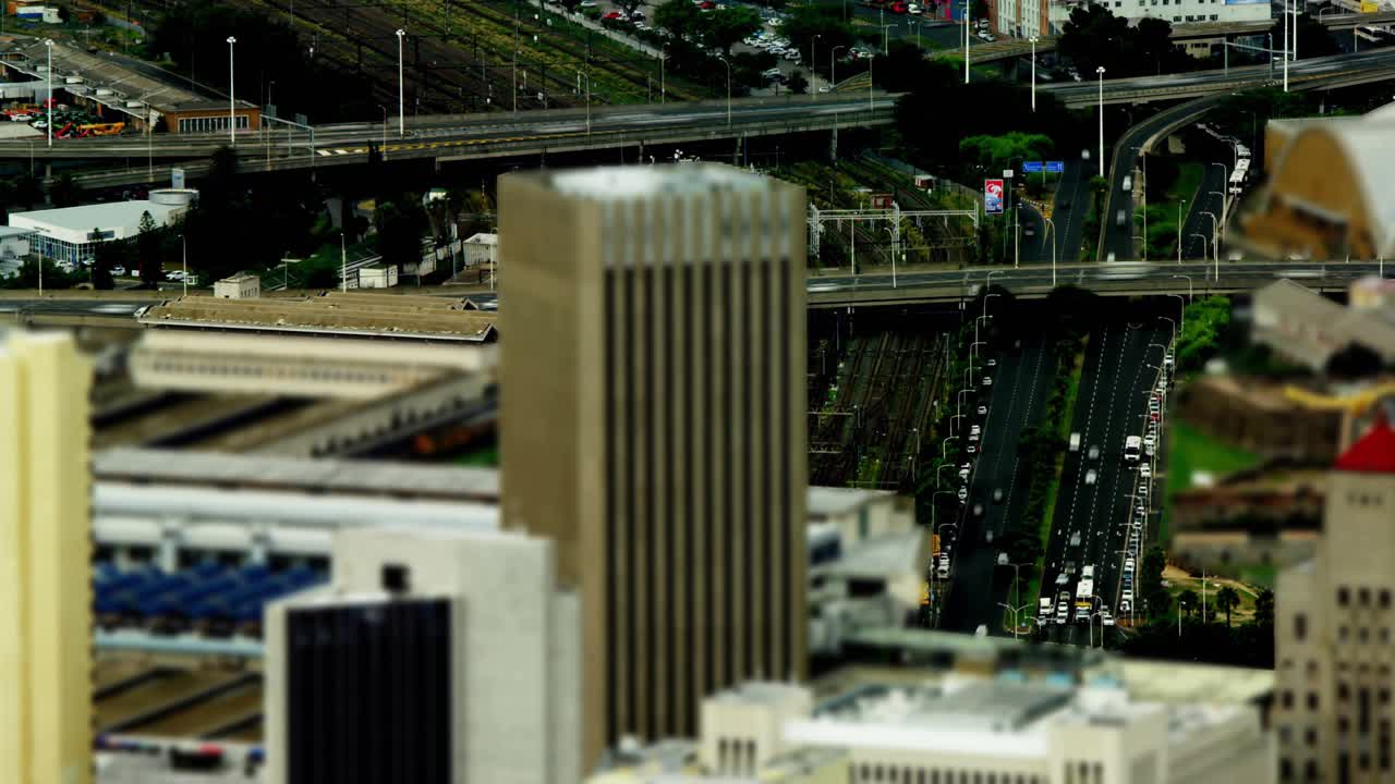Data labels starting with fade-in, floating and clustering around tall beige tower, mapping metrics