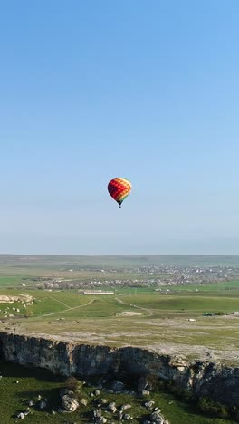 hot air balloon over a scenic valley