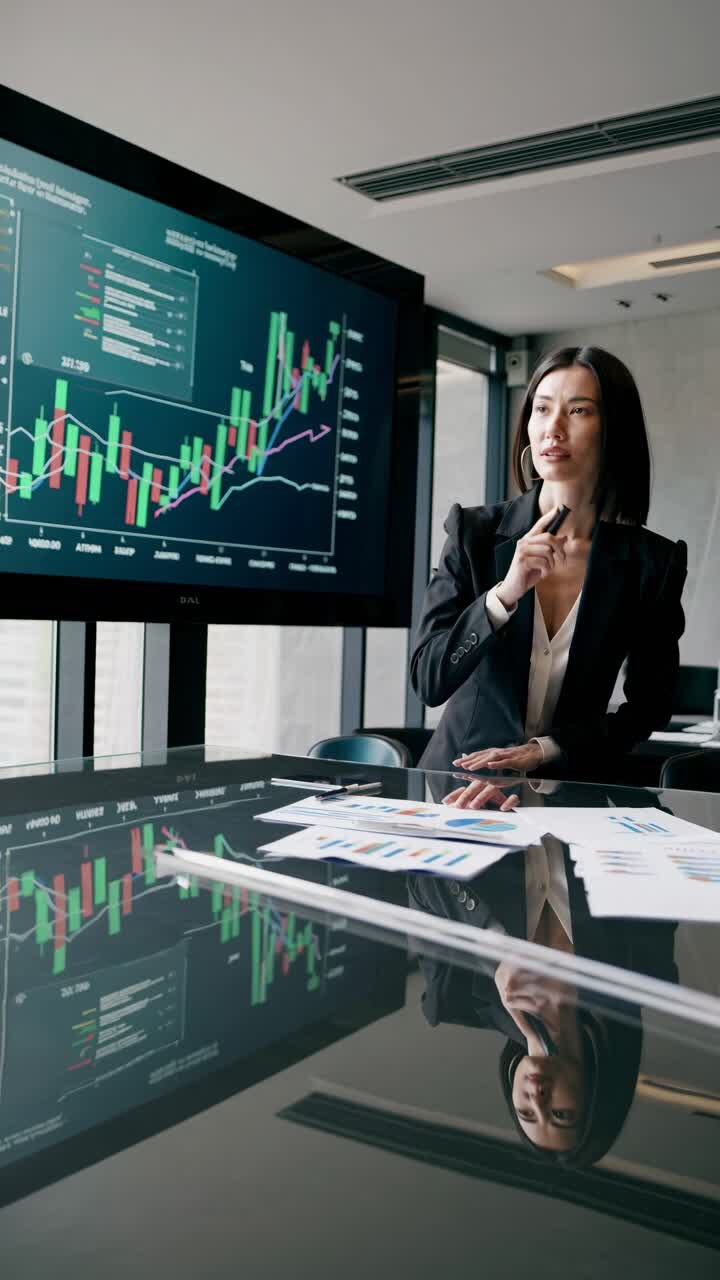 Businesswoman presenting financial data in a modern office