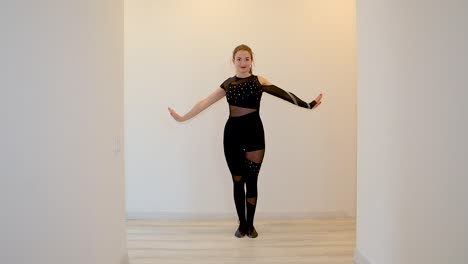 energetic advance home dance performance by a caucasian female dancer in dark outfit slow motion white background