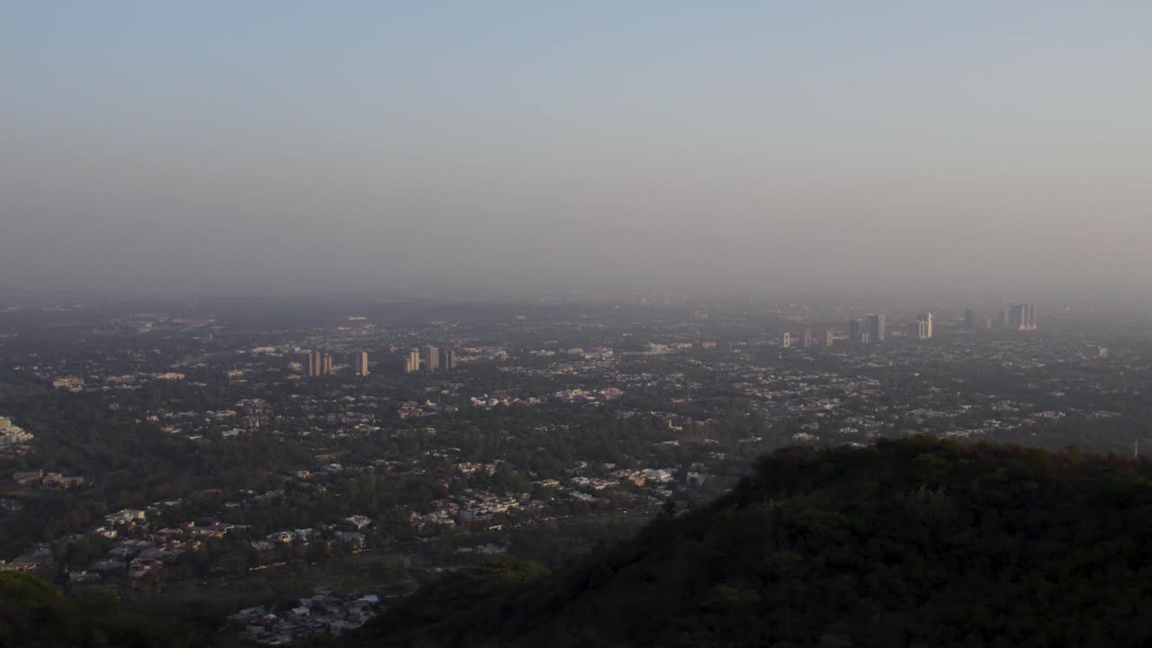Evening view of Islamabad's skyline and urban sprawl from the elevated Margalla Hills. Islamabad