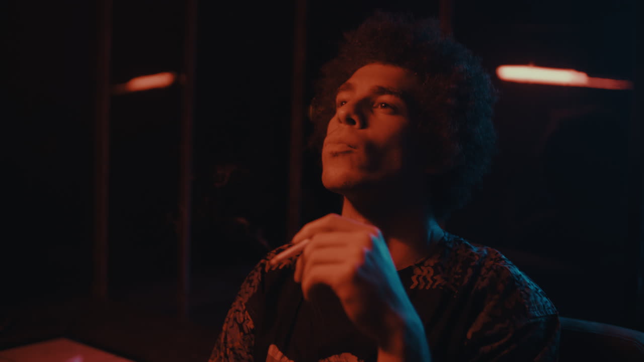 Man Smoking in a Nightclub