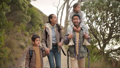 Happy-family,-hiking-and-holding-hands-outdoor