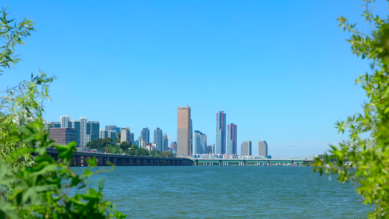Cityscape above the river with mild wind under blusky