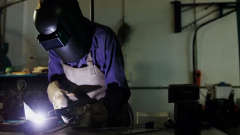 Welder-welding-a-metal