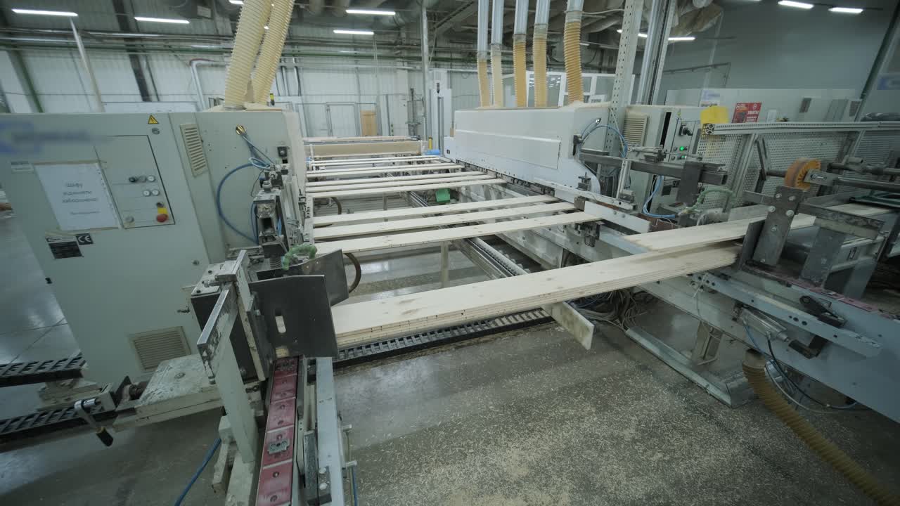 Automated Woodworking Machine Processing Wooden Planks in Factory