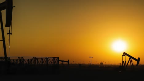 oil pumps time lapse at sunset - zoom in