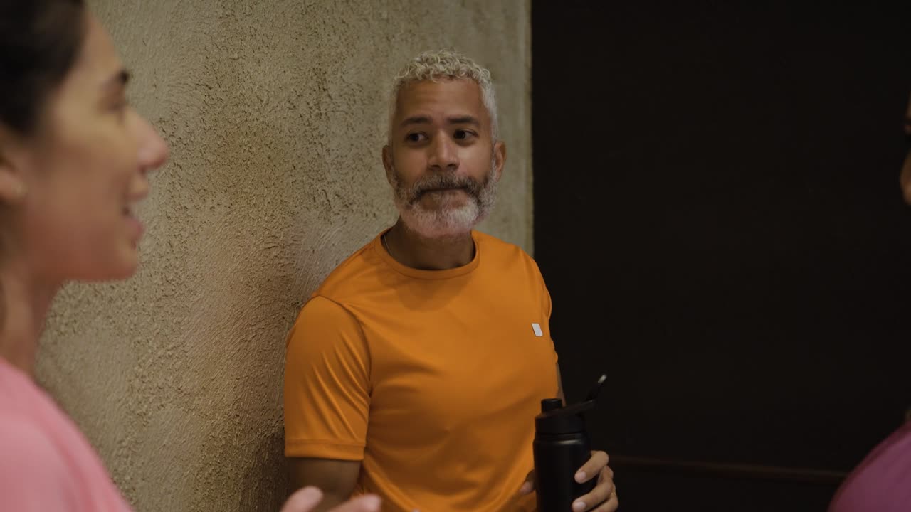 People chatting in a gym after a workout