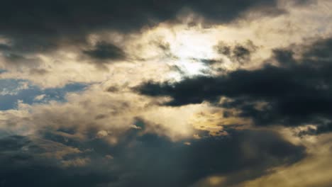 dramatic sunset sky time lapse, bright sunlight and dark silhouette of clouds as a background, extreme weather