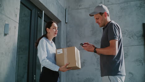 customer receiving a package delivery from a courier