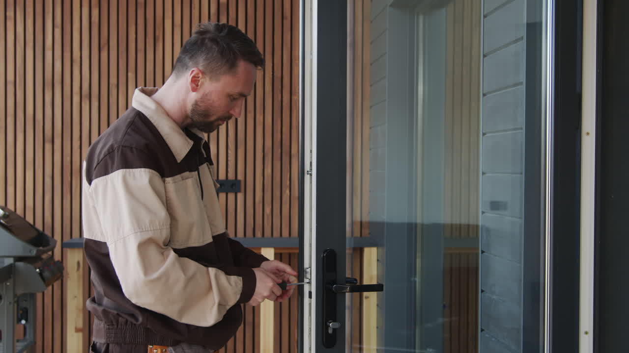 Handyman Repairing Door Lock