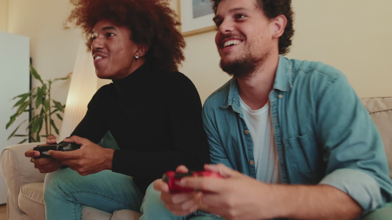 Two friends playing video games together