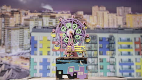Colorful Ferris Wheel scale model in the city -Close up