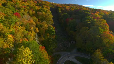 autumn colors shine over the mountains in north carolina as the drone glides low