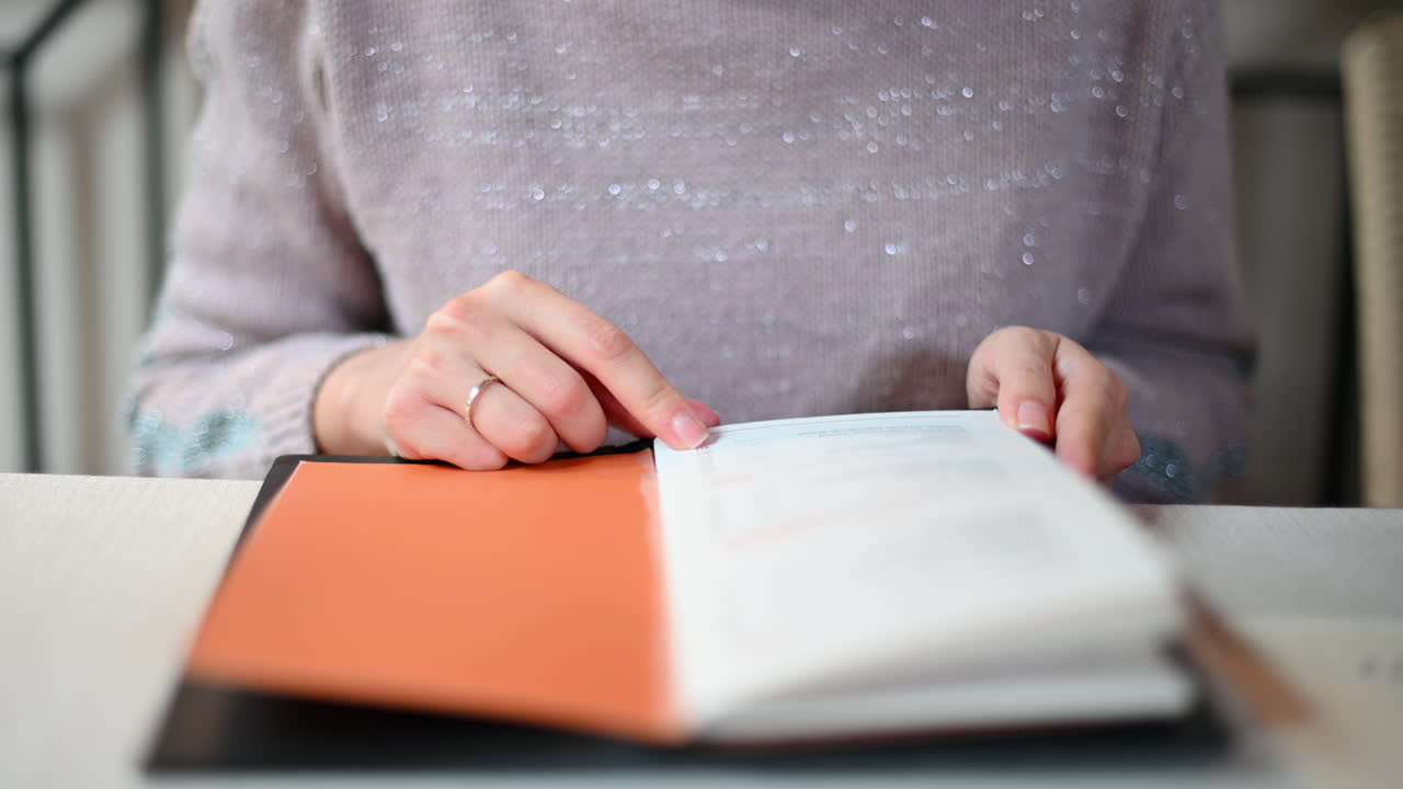 Woman reading a menu at a restaurant at lunch