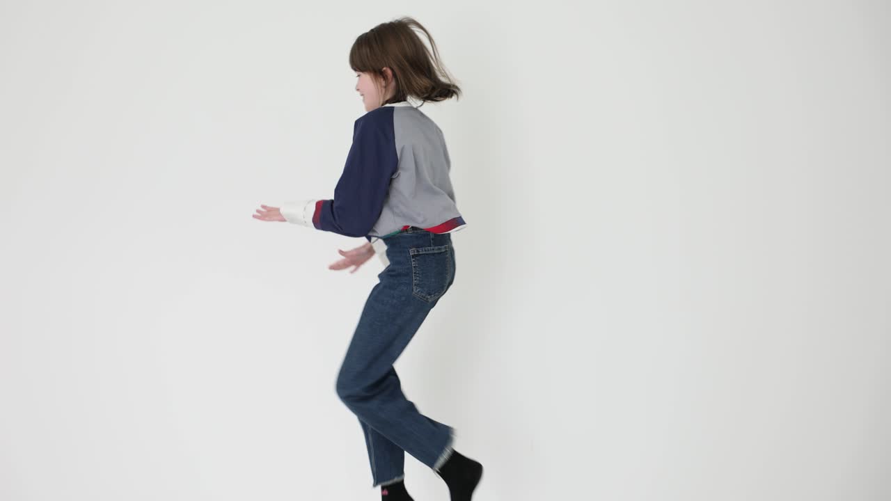A young person jumping and moving on a white background