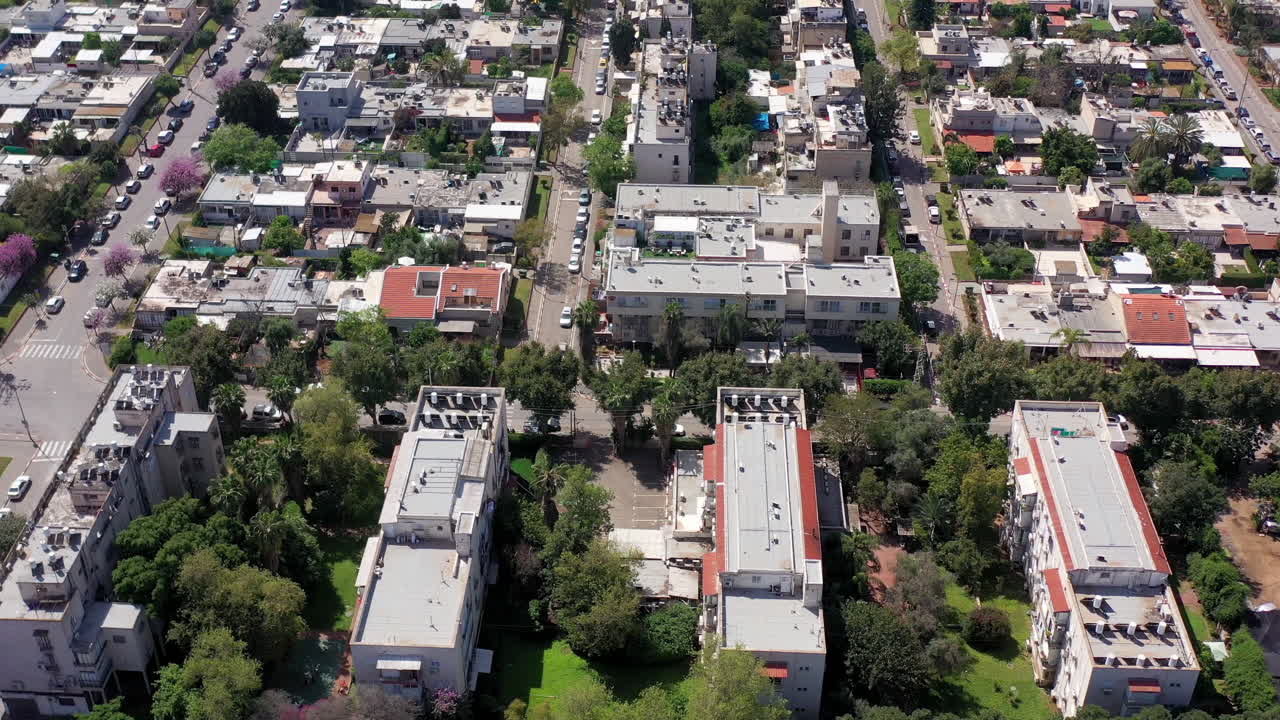 Aerial view of Tel aviv rooftops, with no people and traffic in the streets due to government guidelines