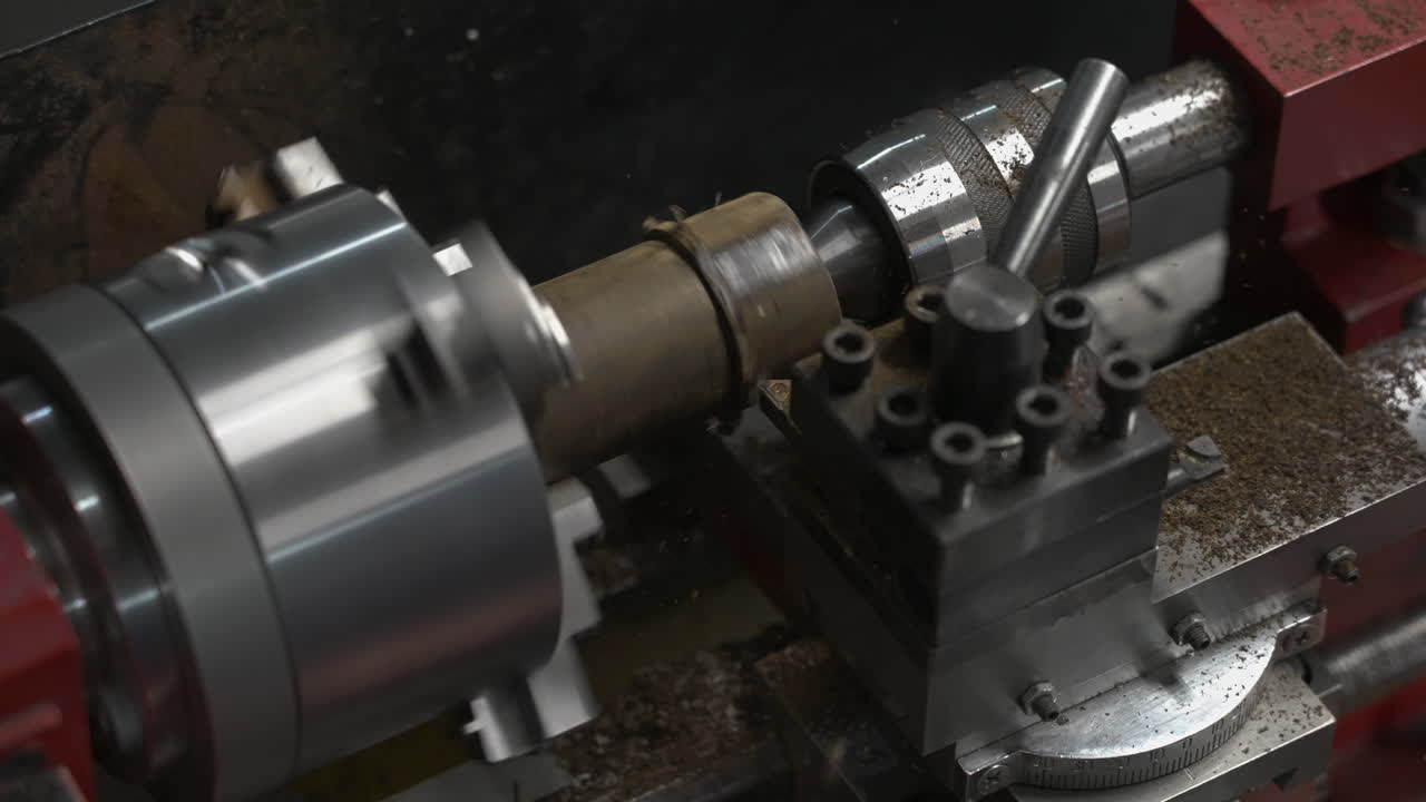 Lathe Machine Shaping A Rotating Cylindrical Workpiece At Wood Factory. slow motion, static shot