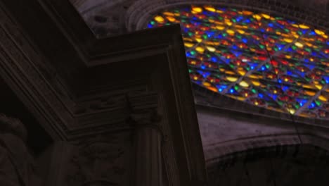 close up worms eye reveal of stained glass window at cathedral of santa maria of palma