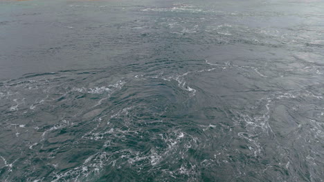 close up strong water current in ocean off