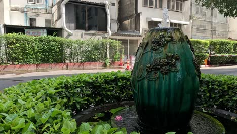 water flowing from decorative garden fountain