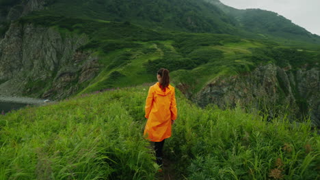 woman hiking in a coastal mountain landscape