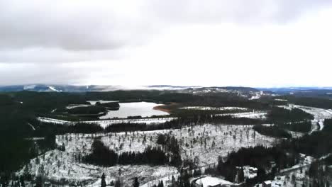 drone shot of a snowy landscape in sweden.